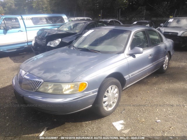 1LNHM97V3XY626517 - 1999 LINCOLN CONTINENTAL  Blau Foto 2