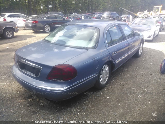 1LNHM97V3XY626517 - 1999 LINCOLN CONTINENTAL  BLUE photo 4