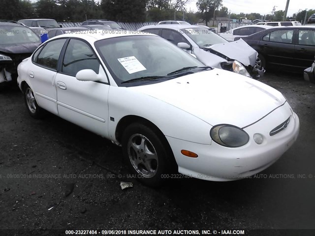 1FAFP53S6XG307292 - 1999 FORD TAURUS SE/COMFORT/SPORT WHITE photo 1