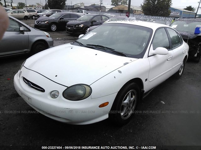 1FAFP53S6XG307292 - 1999 FORD TAURUS SE/COMFORT/SPORT WHITE photo 2