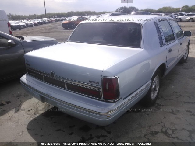 1LNLM81W0VY618619 - 1997 LINCOLN TOWN CAR EXECUTIVE Light Blue photo 4