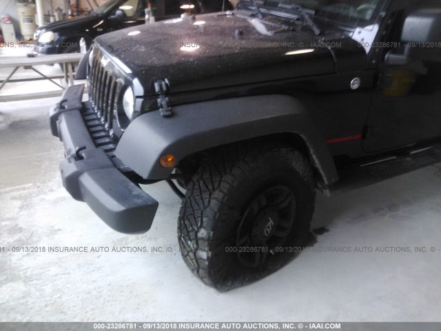 1C4BJWDG4CL234967 - 2012 JEEP WRANGLER UNLIMITE SPORT BLACK photo 6