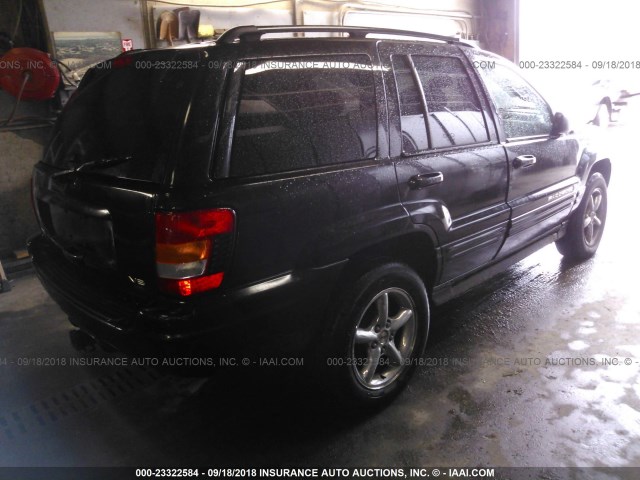 1J8GW68J42C308120 - 2002 JEEP GRAND CHEROKEE OVERLAND BLACK photo 4