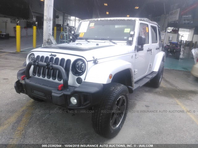 1C4BJWEG3CL264847 - 2012 JEEP WRANGLER UNLIMITE SAHARA SILVER photo 2