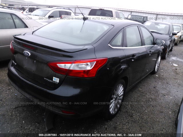 1FAHP3J29CL299352 - 2012 FORD FOCUS TITANIUM BLACK photo 4