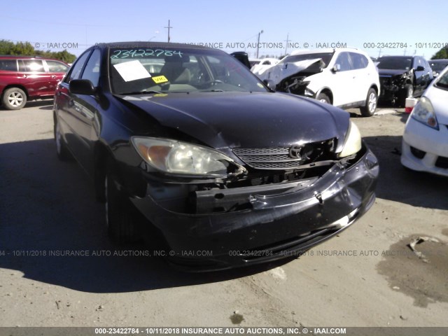 4T1BE32K72U057510 - 2002 TOYOTA CAMRY LE/XLE/SE BLACK photo 1
