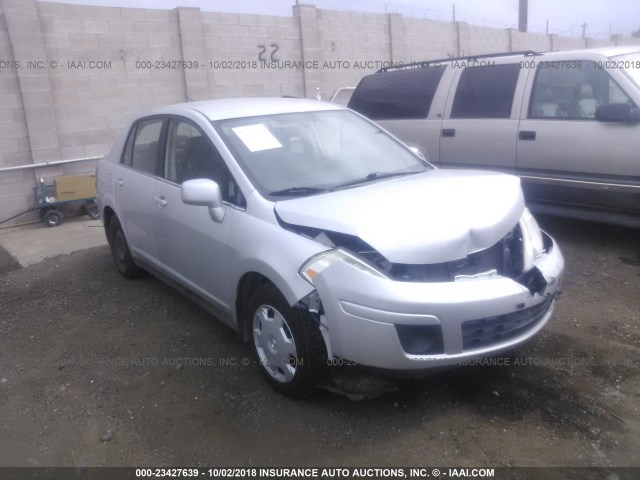 3N1BC11E59L385154 - 2009 NISSAN VERSA S/SL SILVER photo 1