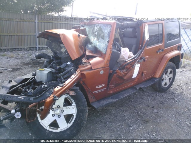 1J4BA5H10AL176542 - 2010 JEEP WRANGLER UNLIMITE SAHARA ORANGE photo 2