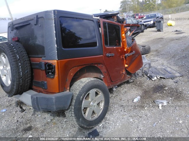 1J4BA5H10AL176542 - 2010 JEEP WRANGLER UNLIMITE SAHARA ORANGE photo 4