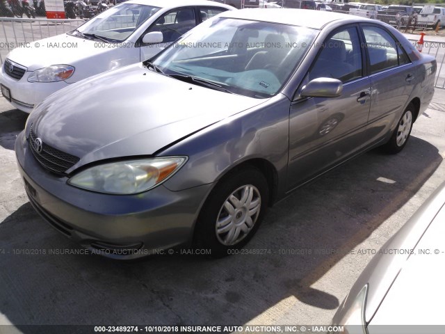 JTDBE32KX40293065 - 2004 TOYOTA CAMRY LE/XLE 金色 照片 2