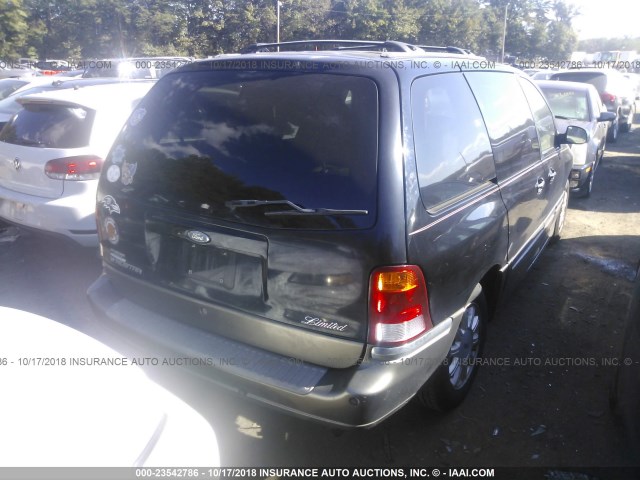 2FMDA584X2BA90712 - 2002 FORD WINDSTAR LIMITED BLACK photo 4