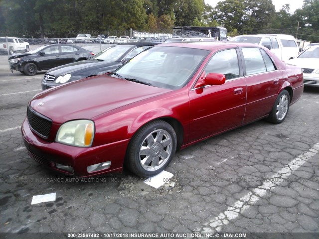 1G6KF57904U144030 - 2004 CADILLAC DEVILLE DTS RED photo 2