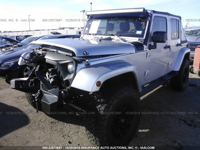 1J4GA59109L765610 - 2009 JEEP WRANGLER UNLIMITE SAHARA SILVER photo 2