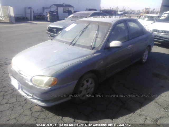 KNAFB1218Y5884569 - 2000 KIA SEPHIA LS GREEN photo 2