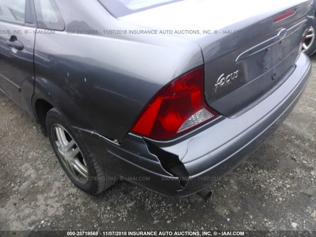 1FAFP38Z74W137696 - 2004 FORD FOCUS ZTS GRAY photo 6