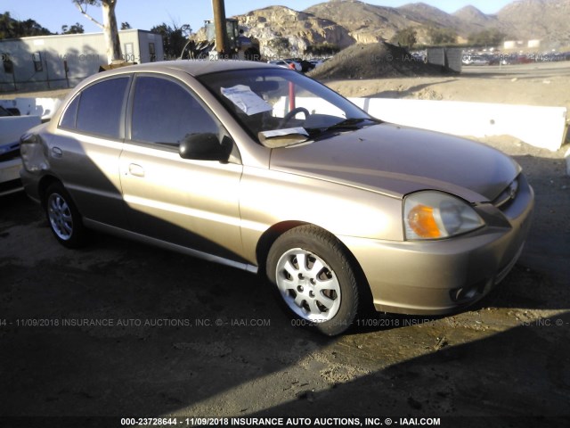 KNADC125746337014 - 2004 KIA RIO GOLD photo 1