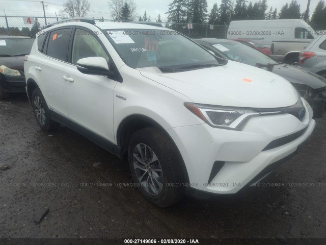 JTMRJREV8JD219571 - 2018 TOYOTA RAV4 HV LE PLUS/XLE WHITE photo 1